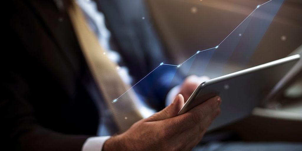 businessman analyzing stock market charts on digital tablet in office