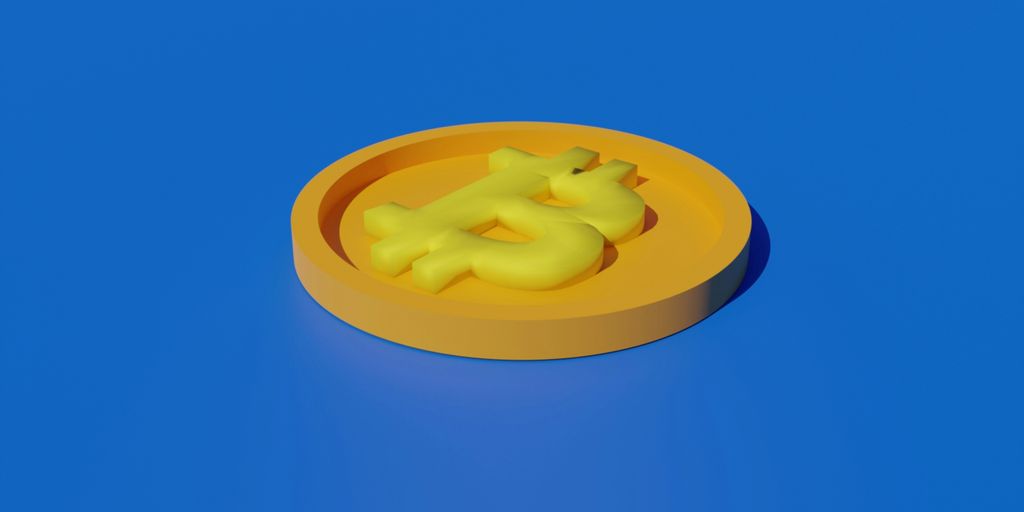 a yellow plastic object sitting on top of a blue surface