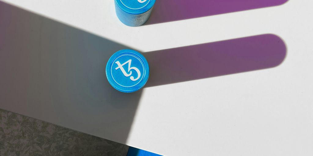 a couple of blue and purple markers sitting on top of a table