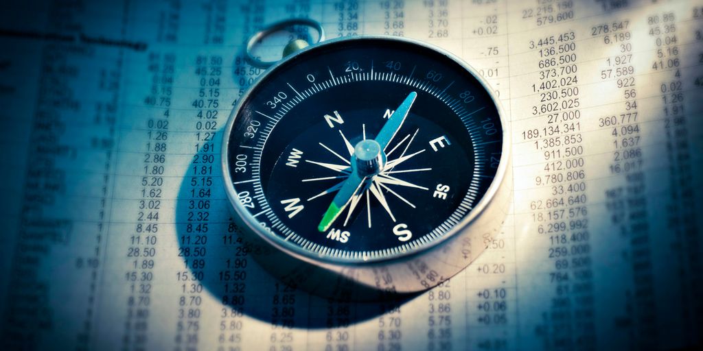 shallow focus photograph of black and gray compass